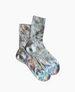 A pair of iridescent socks with a shimmering, multicolored pattern featuring hues of silver, blue, and purple, crafted from a smooth, stretchy fabric with a ribbed texture at the cuffs. 3