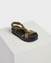 A sandal with an olive green, twisted strap design and a black, cushioned sole, featuring an elasticized back strap for a secure fit. 1