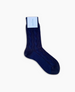 A single navy blue sock with a textured, cable-knit pattern, mid-calf length, made of a soft, likely cotton or wool blend material, featuring a white label attached near the top. 5