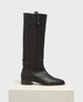 A sleek, knee-high black leather boot with a smooth texture, featuring a side zipper, a low stacked heel, and a rounded toe, displayed on a minimalist white pedestal. 1