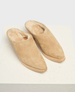 Beige suede slippers with a pointed toe, plush fur lining, and a flat sole, featuring a minimalist design and soft texture. 4