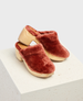 Plush, rust-colored clogs with a soft, fuzzy texture and a light wooden sole, featuring a chunky heel and an open back design. 1