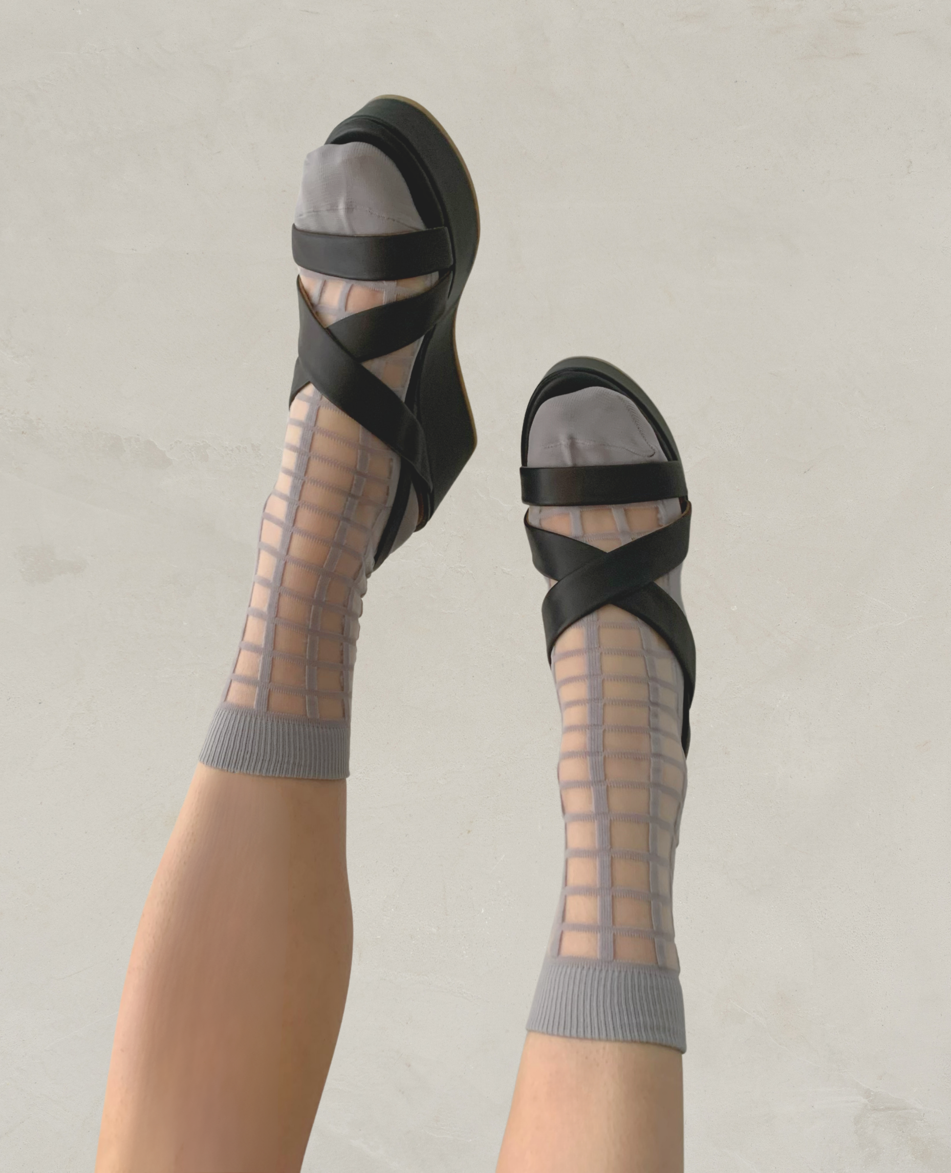 Legs wearing the Lylo Wedge in Black.