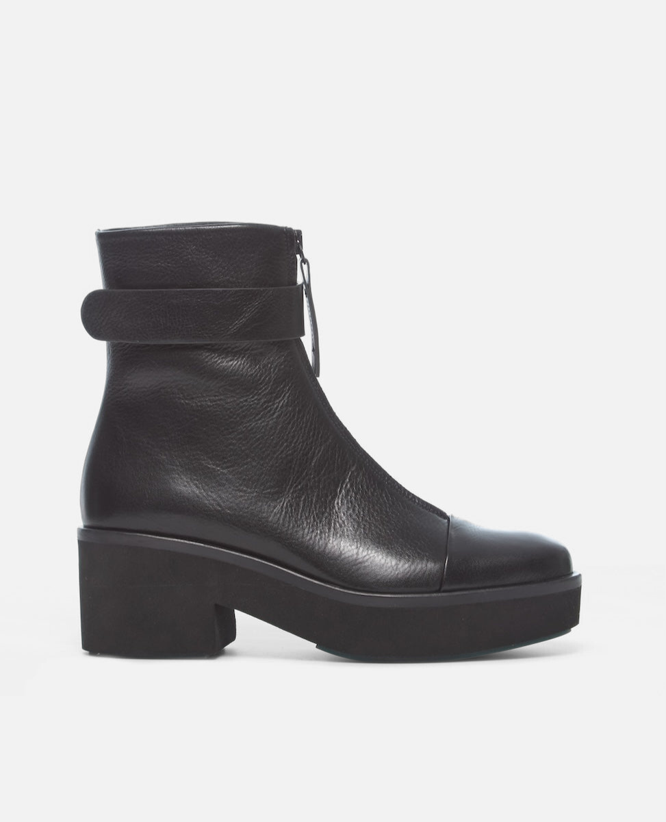 Black leather ankle boot on a white background