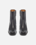 Pair of black ankle boots on a white background 3
