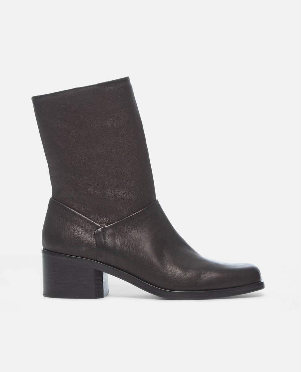 Black leather ankle boot on a white background