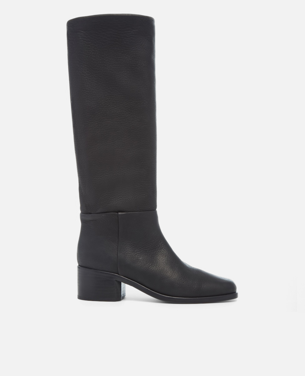 Black knee-high boot on a light gray background