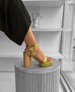 A foot on a pedestal wearing the Angel Chartreuse 6