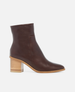 Brown ankle boot with wooden block heel on a white background 1