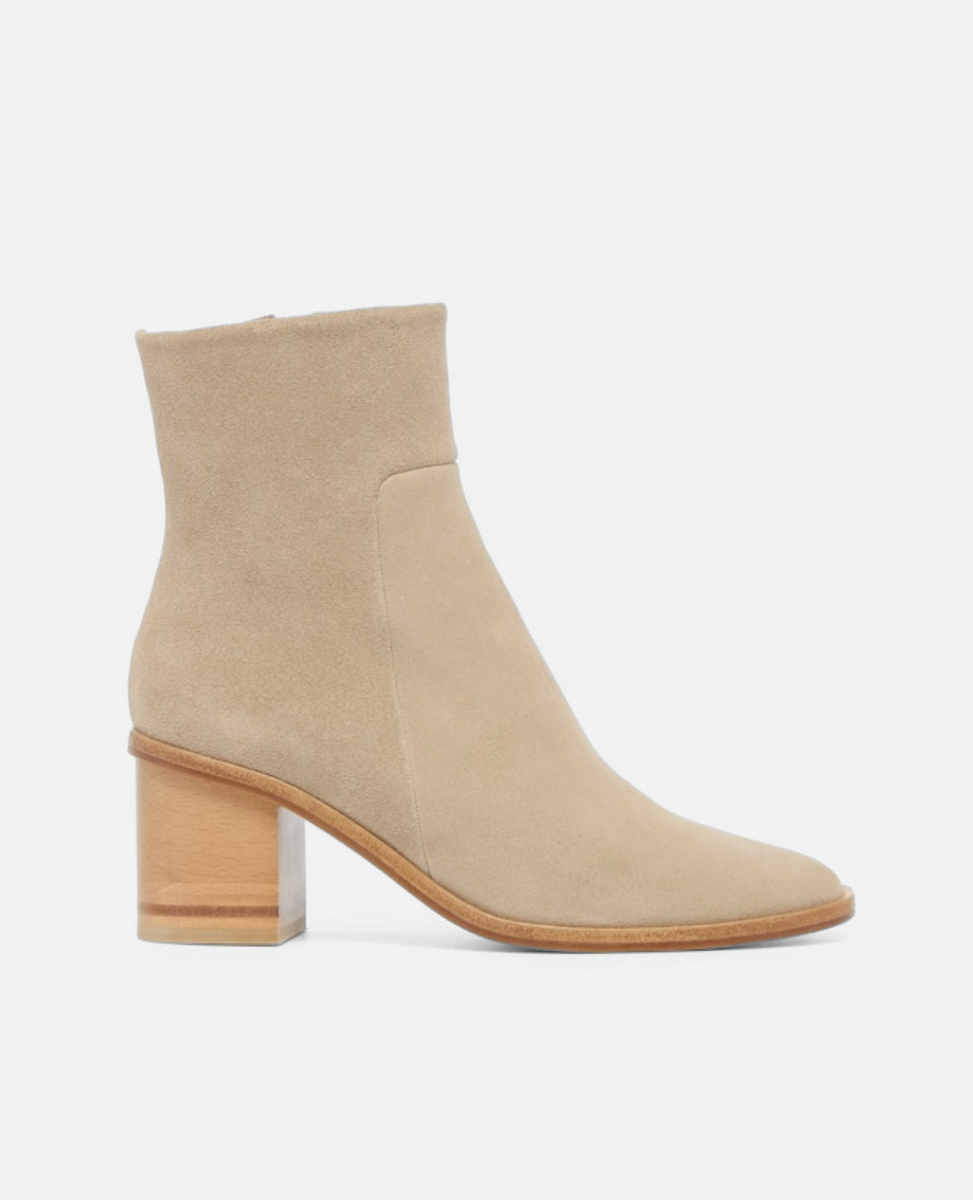 Beige ankle boot with a block heel on a white background