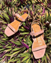 Fifi sandal from the top, placed on a tropical plant 2