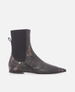 Black ankle boot with metallic pattern on a white background 1