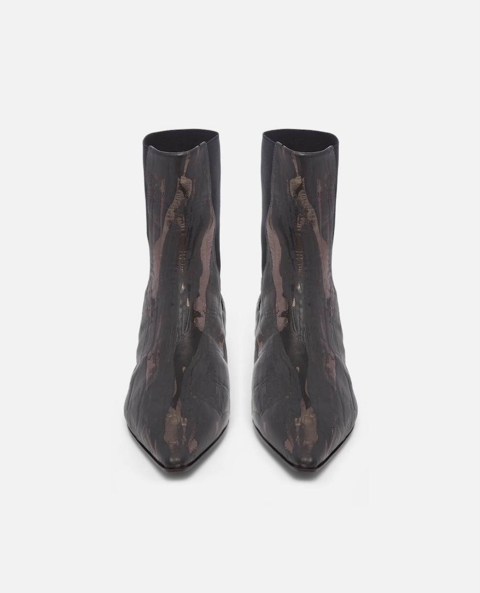 Pair of black pointed-toe boots on a white background