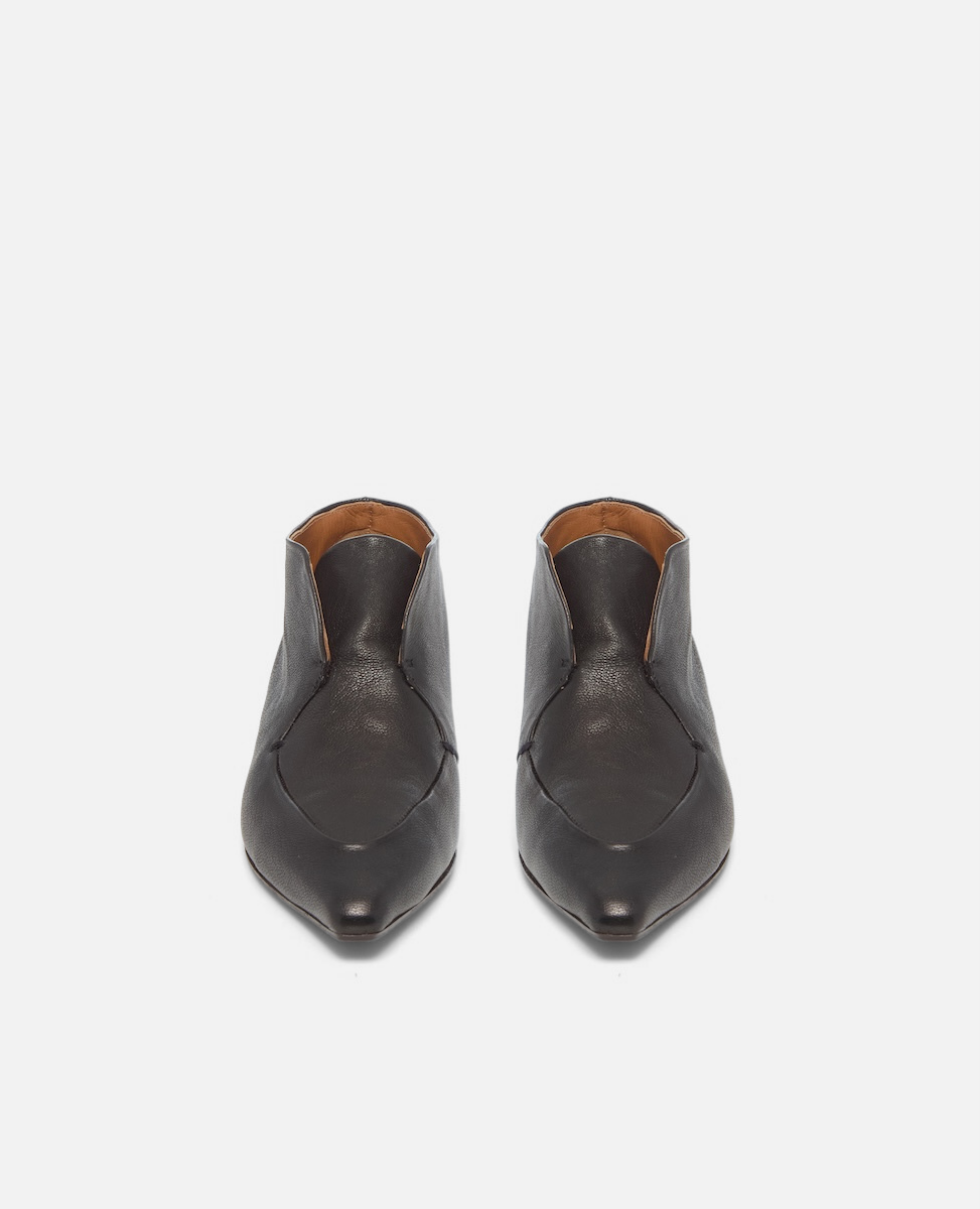 Pair of black leather shoes on a white background