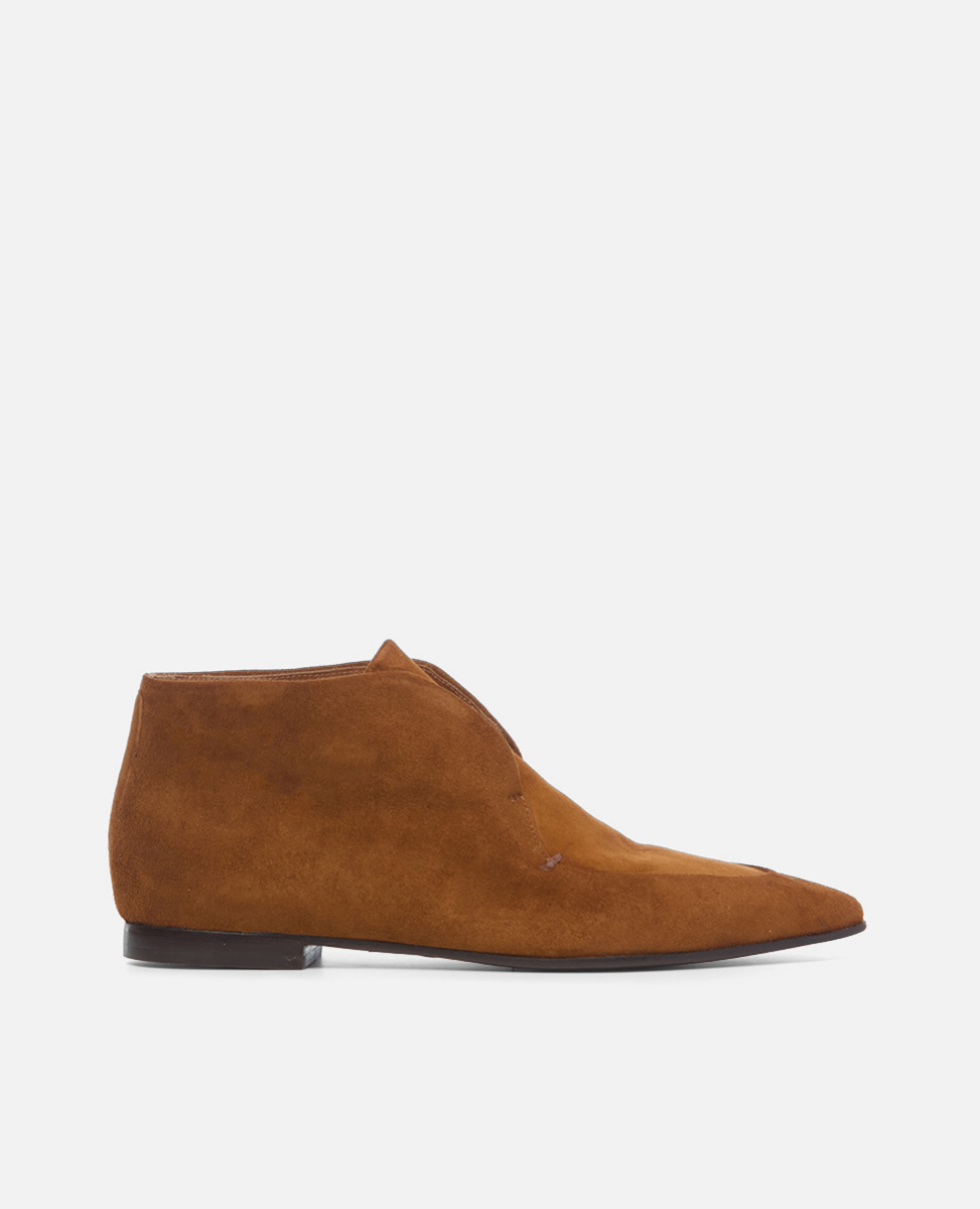 Brown suede shoe on a white background