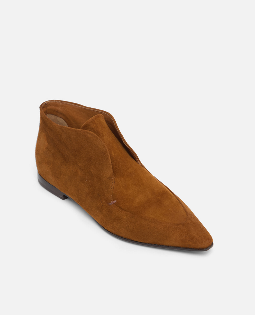 Brown suede shoe on a white background