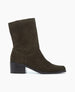 A mid-calf, dark olive green suede boot with a slightly pointed toe, a low block heel, and a smooth, matte finish. 5