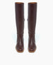 A pair of tall, brown leather boots with a smooth, polished finish, rounded toes, and a slight heel, featuring a zipper on the side for easy wear. 4