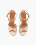 Beige open-toe sandals with crisscross straps, a slim ankle strap with a buckle, and a smooth leather finish. 5