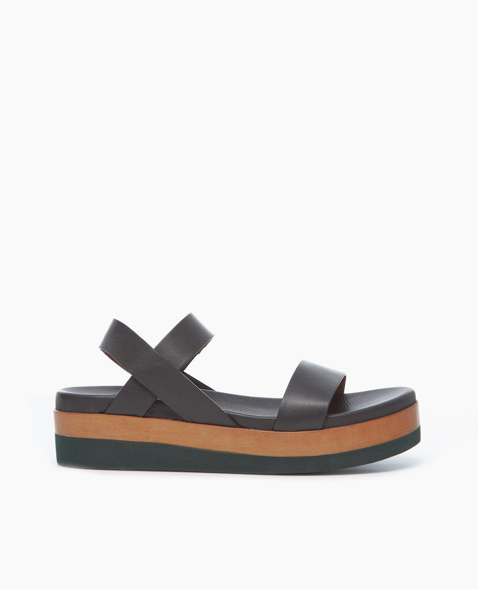 Side view of the Dana Wedge featuring an easy run-around upper that sits atop a molded footbed and an ultra-lightweight EVA platform unit.
