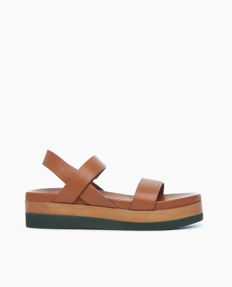 Side view of the Dana Wedge featuring an easy run-around upper that sits atop a molded footbed and an ultra-lightweight EVA platform unit