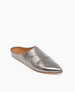 A sleek, metallic silver mule with a pointed toe, textured surface, and a flat tan sole. 6