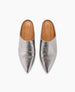 Silver metallic pointed-toe mules with a smooth, shiny texture, featuring a slip-on design and tan leather insoles. 7