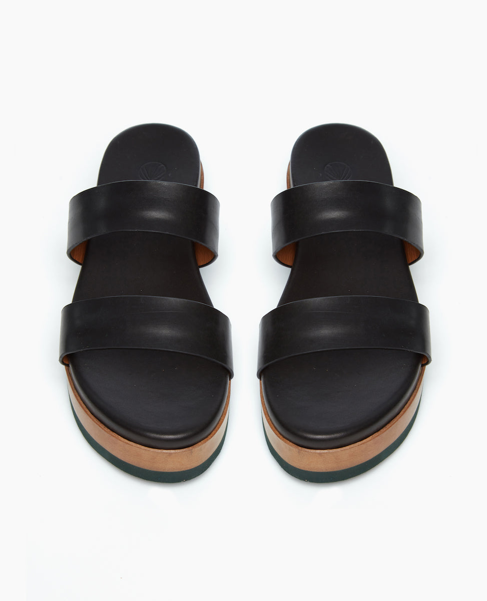 Front view of the Dawn Wedge, featuring an easy two-strap slide with an upper that sits atop a molded footbed and an ultra-lightweight EVA platform unit. 