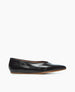 A sleek, black leather flat shoe with a pointed toe, smooth texture, and a thin, light brown sole. 4