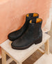 A pair of deep sea split suede Chelsea boots with a matte finish, featuring elastic side panels, a rounded toe, a mid-height platform heel, and a tan leather lining. 7