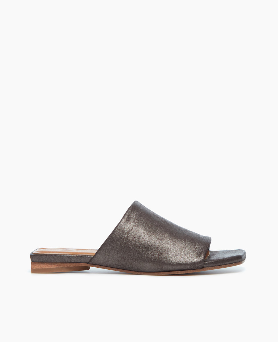 Side view of the Ferhana Sandal in anthracite shimmer suede designed to hug the foot with a stacked leather heel, perfect for all day everyday wear. 