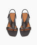 Front view of the Finch Sandal in Black, featuring a wide-strap thong and a slim elasticized leather strap at the heel.  5