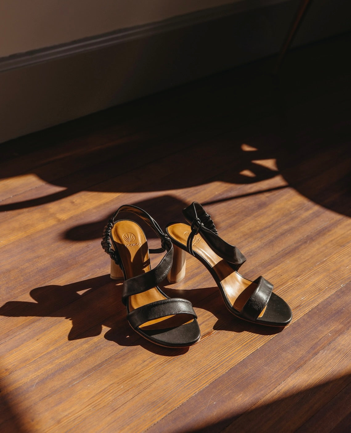 The Gabby Heel in Deep Sea placed on a wooden floor with sunlight beaming.