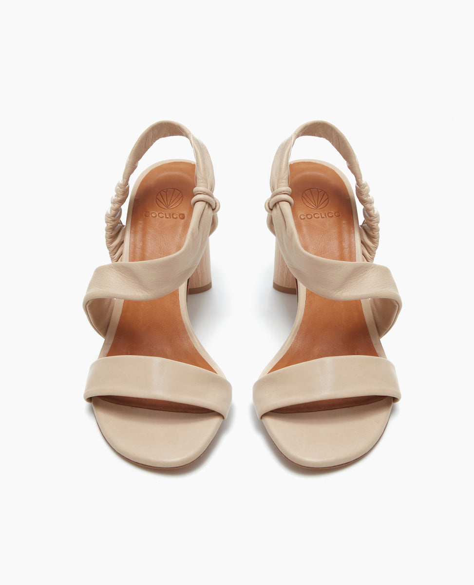 Front view of the Gabby Heel in Latte Macchiato featuring soft, tubular straps that mold to the foot and sculpted heel from solid Ash wood.