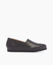 A sleek, black leather slip-on shoe with a smooth texture, low profile, rounded toe, and flat sole. 2