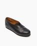 A sleek black leather slip-on shoe with a smooth texture, rounded toe, low wedge heel, and a subtle V-shaped opening. 3