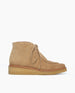 A tan split suede ankle boot with a crepe sole, featuring a lace-up front and a minimalist design. 5