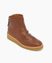 A brown leather ankle boot with a smooth texture, a rounded toe, a side zipper, and a thick, beige crepe sole. 7