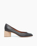 Side view of the Icy Pump in Black Leather with its solid, architectural block wood heel.  1