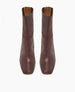 A pair of brown, mid-calf, square-toe boots with a smooth, slightly shiny texture and a subtle seam running vertically down the front. 8