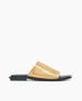 A sleek, flat sandal featuring a shiny gold metallic upper with a wide strap and a contrasting black sole. 2