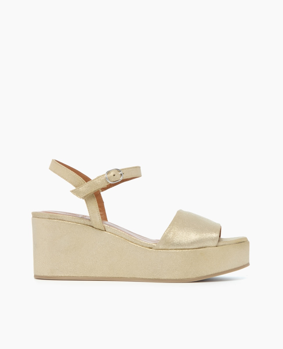 Side view of the Lauren Wedge in Champagne Shimmer Suede