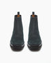 A pair of deep sea split suede Chelsea boots with a smooth texture, black rubber soles, elastic side panels, and pull tabs at the back. 7