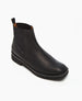 A sleek black leather ankle boot with a smooth texture, rounded toe, low block heel, and a pull tab at the back. 6