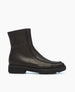 A sleek, black leather ankle boot with a smooth texture, featuring a rounded toe, side zipper, and a chunky rubber sole for added durability and style. 5