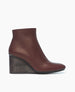 Side view of the Lodi Boot in Merlot; featuring a solid-wood, sculpted, and inset wedge. Inside zip closure 1