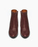 Coclico Lodi Boot in Merlot. Front view featuring a solid-wood, sculpted, and inset wedge. Inside zip closure 3