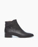 A sleek, black leather ankle boot with a smooth texture, a low block heel, a side zipper, and a strap with a buckle around the ankle. 2