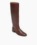 A tall, brown leather boot with a smooth texture, a rounded toe, a low black heel, and a sleek, minimalist design. 3