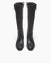 A pair of tall, black leather boots with a sleek design and pull tabs at the top, displayed against a white background. 7